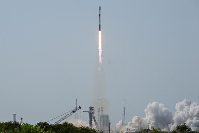 A SpaceX Falcon 9 rocket carrying Northrop Grumman's Mission Robotic Vehicle (MRV) and Mission Extension Pods (MEPs) launches from Space Force Station's Launch Complex 40 in Cape Canaveral, Florida, on July 21, 2026. (Photo by CHANDAN KHANNA / AFP)
