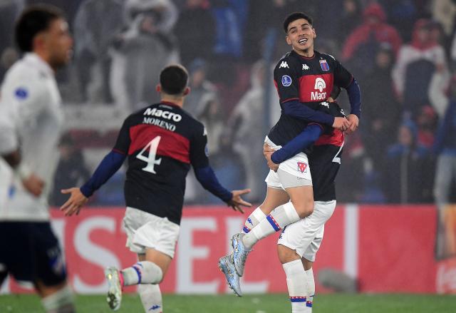 Tigre's midfielder #33 Elias Cabrera (2nd R) celebrates with teammates after scoring the team's third goal during the first leg of the Copa Sudamericana knockout round play-off football match between Uruguay's Nacional and Argentina's Tigre at the Gran Parque Central satdium in Montevideo, on July 21, 2026. (Photo by Dante FERNANDEZ / AFP)