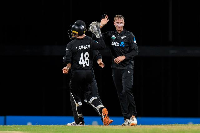 Jayden Lennox (R) of New Zealand celebrates the dismissal of Shai Hope of West Indies during the fifth and final one day international (ODI) cricket match between West Indies and New Zealand at Kensington Oval in Bridgetown, Barbados on July 21, 2026. (Photo by Randy Brooks / AFP)