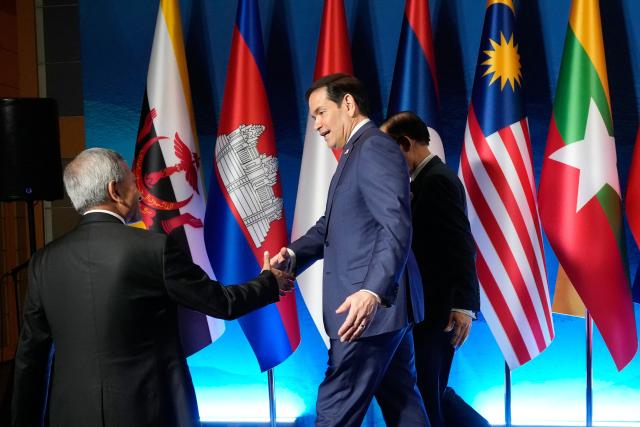 Singapore's Foreign Minister Vivian Balakrishnan (L) shakes hands with US Secretary of State Marco Rubio after a group photo session during the ASEAN Post Ministerial Conference with the US on the sidelines of the Association of Southeast Asian Nations (ASEAN) Foreign Ministers' Meeting in Pasay, Metro Manila on July 22, 2026. (Photo by Aaron Favila / POOL / AFP)