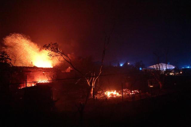 A house is consumed by fire in Cotignac, southeastern France, on July 22, 2026. A wildfire advancing at surprising speed in southern France forced the evacuation of nearly 400 people from several villages on July 21, 2026, the top official for the Var region said. The evacuations took place around the villages of Cotignac, Montfort-sur-Argens and Correns, and some 1,700 hectares (4,200 acres) have already burned, the official added. (Photo by Thibaud MORITZ / AFP)