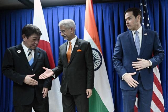Japan's Foreign minister Toshimitsu Motegi (L) shakes hands with India's Foreign Minister  S. Jaishankar as US Secretary of State Marco Rubio looks on on the sidelines of the Association of Southeast Asian Nations (ASEAN) Foreign Ministers' Meeting in Pasay, Metro Manila on July 22, 2026. (Photo by Brendan SMIALOWSKI / POOL / AFP)