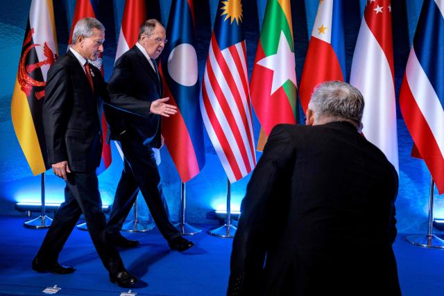 Singapore's Foreign Minister Vivian Balakrishnan (L) and Russia's Foreign Minister Sergey Lavrov arrive for a group photo during the ASEAN Post-Ministerial Conference with Russia on the sidelines of the Association of Southeast Asian Nations (ASEAN) Foreign Ministers' Meeting in Pasay, Metro Manila on July 22, 2026. (Photo by Ezra Acayan / POOL / AFP)