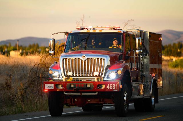 CalFire firefighters drive toward Little Fire in Pleasanton, California on July 21, 2026. (Photo by Josh Edelson / AFP)