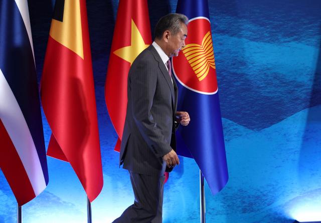 Chinese Foreign Minster Wang Yi arrives for the ASEAN Post Ministerial Conference with China on the sidelines of the Association of Southeast Asian Nations (ASEAN) Foreign Ministers' Meeting in Pasay, Metro Manila on July 22, 2026. (Photo by ELOISA LOPEZ / POOL / AFP)