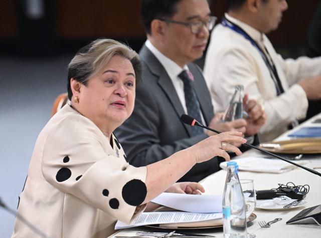 Philippine Foreign Secretary Theresa Lazaro Lazaro holds a bilateral meeting with China's Foreign Minister Wang Yi (not pictured) on the sidelines of the Association of Southeast Asian Nations (ASEAN) Foreign Ministers' Meeting in Pasay, Metro Manila on July 22, 2026. (Photo by Ted ALJIBE / POOL / AFP)