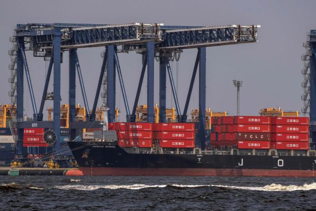 A container ship is docked at the international cargo terminal in Tokyo on July 22, 2026. (Photo by Yuichi YAMAZAKI / AFP)