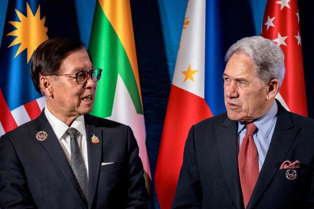 New Zealand's Foreign Minister Winston Peters (R) speaks with Thailand's Deputy Prime Minister and Foreign Minister Sihasak Phuangketkeow before a group photo during the ASEAN Post-Ministerial Conference with New Zealand on the sidelines of the ASEAN Foreign Ministers' Meeting at the Philippine International Convention Center in Pasay, Metro Manila on July 22, 2026. (Photo by Ezra Acayan / POOL / AFP)