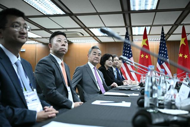 China's Foreign Minister Wang Yi (C) looks on during a bilateral meeting with US Secretary of State Marco Rubio on the sidelines of the Association of Southeast Asian Nations (ASEAN) Foreign Ministers' Meeting in Pasay, Metro Manila on July 22, 2026. (Photo by Brendan SMIALOWSKI / POOL / AFP)