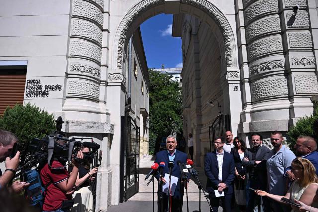 Former Hungarian Prime Minister Viktor Orban of the FIDESZ party holds a press conference in front of the party headquarters, on July 22, 2026 in Budapest, one day after prosecutors had launched a raid on the FIDESZ party's data servers. On July 21, 2026 The Fidesz party of Hungary's nationalist ex-leader Viktor Orban, which was swept from power in elections in April, said on that prosecutors had launched a raid on its data servers. Since ending Orban's hardline 16-year-long rule, the new Prime Minister's new pro-European conservative government has rushed to loosen the self-styled "illiberal" leader's lingering grip on the central European country. (Photo by Attila KISBENEDEK / AFP)