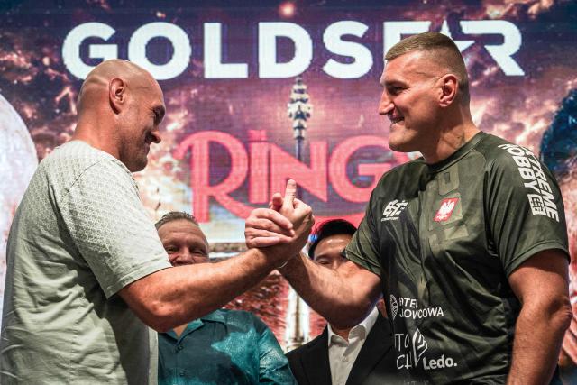 Britain's Tyson Fury (L) and Poland's Mariusz Wach (R) attend a press conference ahead of their charity boxing bout in Pattaya on July 22, 2026. (Photo by Chanakarn LAOSARAKHAM / AFP)
