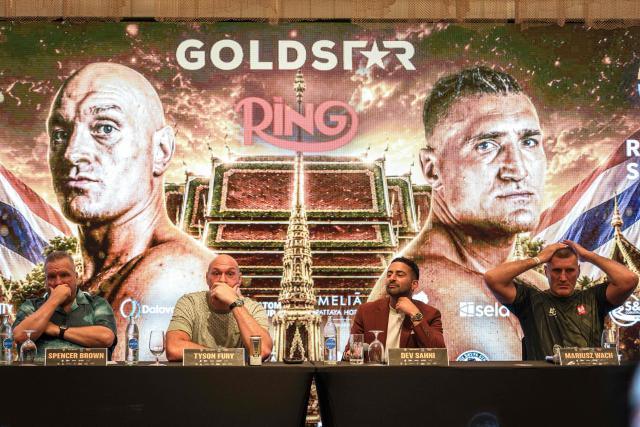 Britain's Tyson Fury (2nd L) and Poland's Mariusz Wach (2nd R) attend a press conference ahead of their charity boxing bout in Pattaya on July 22, 2026. (Photo by Chanakarn LAOSARAKHAM / AFP)