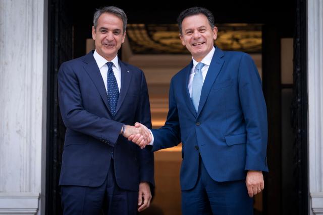 Greece's Prime Minister Kyriakos Mitsotakis (L) welcomes Portugal's Prime Minister Luis Montenegro upon his arrival ahead of their meeting, in Athens on July 22, 2026. (Photo by Aris MESSINIS / AFP)