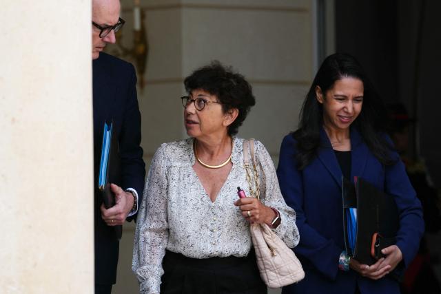 France's Environment Minister Monique Barbut (C), flanked by France's Economy, Finances and Industry Minister Roland Lescure (L) and France's Overseas Minister Naima Moutchou (R), leaves after the weekly cabinet meeting at the Elysee Palace in Paris on July 22, 2026. (Photo by Dimitar DILKOFF / AFP)