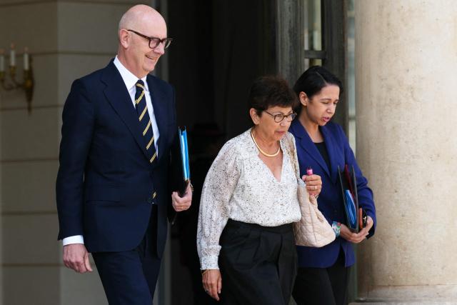 France's Environment Minister Monique Barbut (C), flanked by France's Economy, Finances and Industry Minister Roland Lescure (L) and France's Overseas Minister Naima Moutchou (R), leaves after the weekly cabinet meeting at the Elysee Palace in Paris on July 22, 2026. (Photo by Dimitar DILKOFF / AFP)