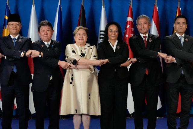 (L-R) Indonesia's Foreign Minister Sugiono, Japanese Foreign Minister Toshimitsu Motegi, Philippine Foreign Secretary Theresa Lazaro, Palestinian Social Development Minister Samah Hamad, Singapore's Foreign Minister Vivian Balakrishnan and Vietnam's Deputy Minister of Foreign Affairs Dang Hoang Giang pose for a group photo during the Conference on Cooperation among East Asian Countries for Palestinian Development (CEAPAD), on the sidelines of the Association of Southeast Asian Nations (ASEAN) Foreign Ministers' Meeting in Pasay city, Metro Manila on July 22, 2026. (Photo by Aaron Favila / POOL / AFP)