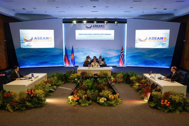 (L-R) Association of Southeast Asian Nations (ASEAN) Secretary General Kao Kim Hourn, Philippine Secretary of Foreign Affairs Theresa Lazaro and Norway's Foreign Minister Espen Barth Eide attend the ASEAN Trilateral Meeting with Norway on the sidelines of the Association of Southeast Asian Nations (ASEAN) Foreign Ministers' Meeting in Pasay, Metro Manila on July 22, 2026. (Photo by Rolex DELA PENA / POOL / AFP)