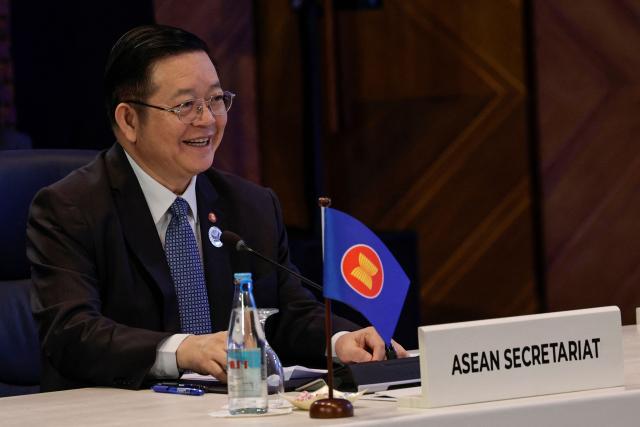 Association of Southeast Asian Nations (ASEAN) Secretary General Kao Kim Hourn looks on during the ASEAN Trilateral Meeting with Norway on the sidelines of the Association of Southeast Asian Nations (ASEAN) Foreign Ministers' Meeting in Pasay, Metro Manila on July 22, 2026. (Photo by Rolex DELA PENA / POOL / AFP)