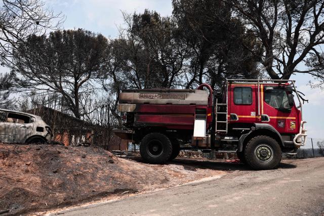 This photograph shows a partially burnt wildland water truck after a wildfire in Ponteves, southeastern France on July 22, 2026. Firefighters have managed to contain the fierce blaze that swept through 2,550 hectares in the Var in less than a day, forcing the evacuation of around 500 people, and which on July 22, 2026 is still burning across a vast mountainside. (Photo by Thibaud MORITZ / AFP)
