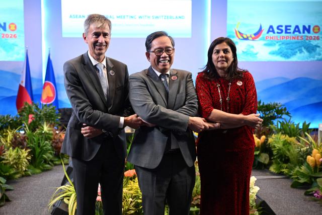 (L-R) Markus Mader, Switzerland's State Secretary for Security and Policy, Leo Herrera-Lim, Philippines' Undersecretary for Policy of the Department of Foreign Affairs, and ASEAN Deputy Secretary General Dato Astanah Abdul Aziz pose for photos during the ASEAN Trilateral Meeting with Switzerland on the sidelines of the Association of Southeast Asian Nations (ASEAN) Foreign Ministers' Meeting in Pasay, Metro Manila on July 22, 2026. (Photo by Ted ALJIBE / POOL / AFP)