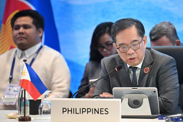 Leo Herrera-Lim (R), Philippines' Undersecretary for Policy of the Department of Foreign Affairs, speaks during the ASEAN Trilateral Meeting with Switzerland on the sidelines of the Association of Southeast Asian Nations (ASEAN) Foreign Ministers' Meeting in Pasay, Metro Manila on July 22, 2026. (Photo by Ted ALJIBE / POOL / AFP)