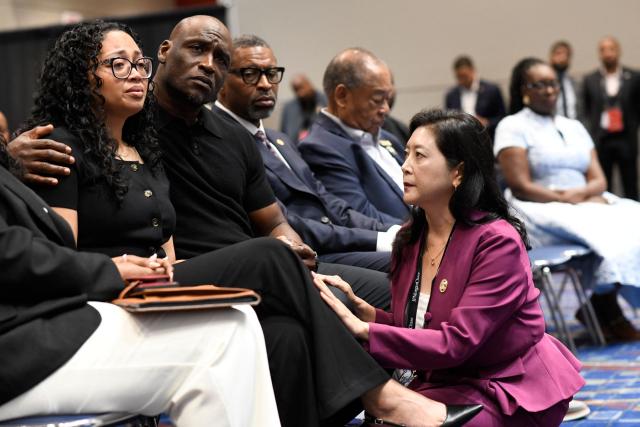 Attorney Liza Park (R) consoles Christine Wonsley and her husband Elmore Wonsley, parents of Nolan Xavier Wells, while NAACP President Derrick Johnson looks on during civil rights and personal injury attorney Ben Crump's speech during a news conference at the 117th NAACP National Convention at McCormick Place in Chicago, Illinois, on July 22, 2026. Crump unveiled the preliminary findings of an independent autopsy conducted on behalf of the Wells family. Wells, an 18-year-old Mississippi college student, was found dead after a boat trip with friends on July 4. (Photo by Octavio Jones / AFP)