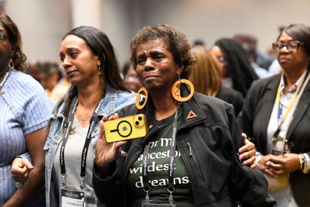 NAACP members join in a closing prayer following a news conference with civil rights and personal injury attorney Ben Crump during the 117th NAACP National Convention at McCormick Place in Chicago, Illinois, on July 22, 2026. Civil rights and personal injury attorney Ben Crump unveiled the preliminary findings of an independent autopsy conducted on behalf of the Wells family. Nolan Xavier Wells, an 18-year-old Mississippi college student, was found dead after a boat trip with friends on July 4. (Photo by Octavio Jones / AFP)