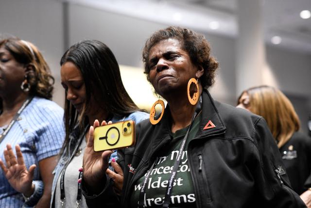 NAACP members join in a closing prayer following a news conference with civil rights and personal injury attorney Ben Crump during the 117th NAACP National Convention at McCormick Place in Chicago, Illinois, on July 22, 2026. Civil rights and personal injury attorney Ben Crump unveiled the preliminary findings of an independent autopsy conducted on behalf of the Wells family. Nolan Xavier Wells, an 18-year-old Mississippi college student, was found dead after a boat trip with friends on July 4. (Photo by Octavio Jones / AFP)