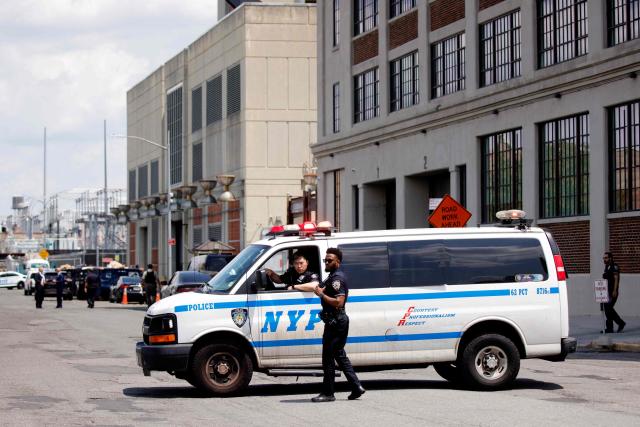 Members of the New York City Police (NYPD) provide security outside the Metropolitan Detention Center in the Brooklyn borough in New York City on July 22, 2026. Venezuela's ousted president Nicolas Maduro is set to appear before a New York court Wednesday, his third public hearing since the US military captured him in a stunning nighttime raid in January. The former leader, 63, and wife Cilia Flores have been held in a Brooklyn jail since the US military operation, awaiting trial on drug trafficking, firearms and other charges. (Photo by Leonardo MUNOZ / AFP)
