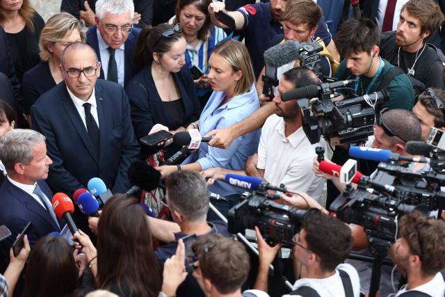 France's Interior Minister Laurent Nunez (L) reacts as he speaks to the press after visiting a fire station in Bordeaux, south-western France, on July 22, 2026. As fires multiply across the country and three firefighters have died in two weeks, including two in Gironde where the interior minister visits on July 22, the profession is sounding the alarm. On July 21, two 34-year-old professionals were trapped in their tanker truck by a “highly aggressive” pine fire near Bordeaux-Mйrignac airport, in circumstances that have yet to be clarified. (Photo by ROMAIN PERROCHEAU / AFP)