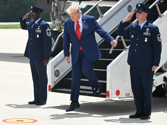 US President Donald Trump disembarks from Air Force One upon arrival at Dobbins Air Reserve Base in Marietta, Georgia, July 22, 2026. Trump is travelling to Wheeler High School in Marietta, Georgia, to deliver remarks. (Photo by SAUL LOEB / AFP)
