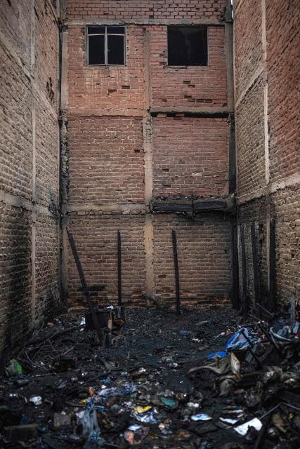 View of a house where a fire killed ten people in Lima on July 22, 2026. A fire in a low-income neighborhood in Lima killed 10 people and destroyed two homes, Peru's civil defense reported. Two more people were injured, the INDECI civil defense institute wrote in a social media post. (Photo by ERNESTO BENAVIDES / AFP)