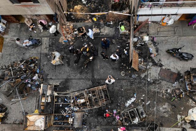 Aerial view of a house where a fire killed ten people in Lima on July 22, 2026. A fire in a low-income neighborhood in Lima killed 10 people and destroyed two homes, Peru's civil defense reported. Two more people were injured, the INDECI civil defense institute wrote in a social media post. (Photo by Ernesto BENAVIDES / AFP)