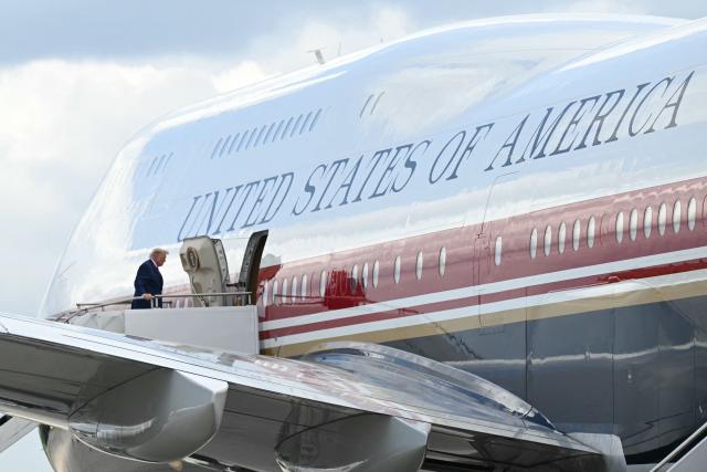 US President Donald Trump boards Air Force One at Dobbins Air Reserve Base in Marietta, Georgia, on July 22, 2026. Trump is travelling to Wheeler High School in Marietta, Georgia, to deliver remarks. (Photo by SAUL LOEB / AFP)