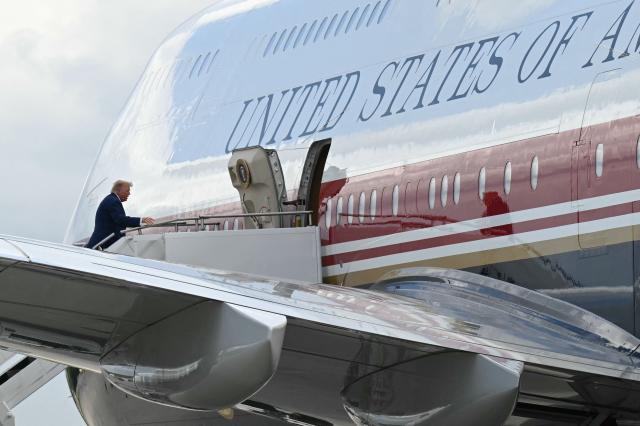 US President Donald Trump boards Air Force One at Dobbins Air Reserve Base in Marietta, Georgia, on July 22, 2026. Trump is travelling to Wheeler High School in Marietta, Georgia, to deliver remarks. (Photo by SAUL LOEB / AFP)