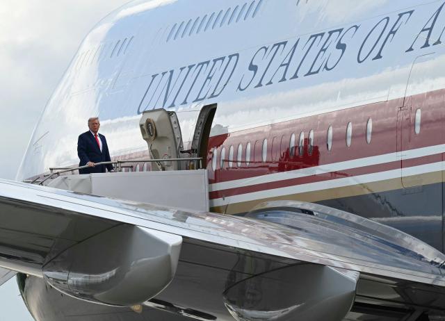 US President Donald Trump boards Air Force One at Dobbins Air Reserve Base in Marietta, Georgia, on July 22, 2026. Trump is travelling to Wheeler High School in Marietta, Georgia, to deliver remarks. (Photo by SAUL LOEB / AFP)