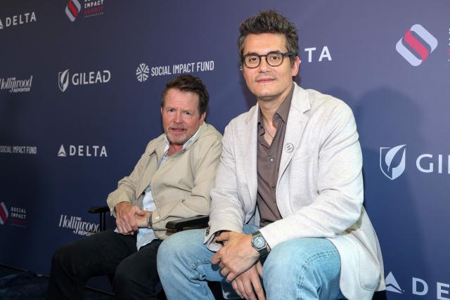 Canadian-US actor Michael J. Fox (L) and US singer/songwriter/guitarist John Mayer attend the third annual Social Impact Summit, hosted by The Hollywood Reporter and the Social Impact Fund, at the DGA Theatre in Los Angeles on July 22, 2026. (Photo by VALERIE MACON / AFP)