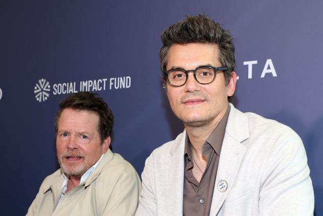 Canadian-US actor Michael J. Fox (L) and US singer/songwriter/guitarist John Mayer attend the third annual Social Impact Summit, hosted by The Hollywood Reporter and the Social Impact Fund, at the DGA Theatre in Los Angeles on July 22, 2026. (Photo by VALERIE MACON / AFP)