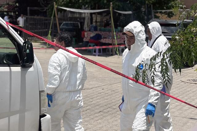 Forensic personnel are pictured at the crime scene where Mexican journalist Alejandro Leyva Aguilar, 58, was killed when he was eating at a restaurant in the San Pablo Etla community, Oaxaca State, Mexico, on July 22, 2026. Francisco Alejandro Leyva Aguilar, who was the director of a local television station and wrote a political column, was killed by armed men who arrived on a motorcycle in the municipality of San Pablo Etla, a source from the prosecutor’s office told AFP. (Photo by VIRGILIO LUIS / AFP)