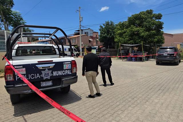 A municipal police pickup truck secures the crime scene where Mexican journalist Alejandro Leyva Aguilar, 58, was killed when he was eating at a restaurant in the San Pablo Etla community, Oaxaca State, Mexico, on July 22, 2026. Francisco Alejandro Leyva Aguilar, who was the director of a local television station and wrote a political column, was killed by armed men who arrived on a motorcycle in the municipality of San Pablo Etla, a source from the prosecutor’s office told AFP. (Photo by VIRGILIO LUIS / AFP)