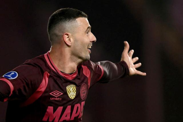 Lanus' midfielder #23 Ramiro Carrera celebrates after scoring his team's second goal during the first leg of the Copa Sudamericana knockout round play-off football match between Argentina's Lanus and Peru's Cienciano, at the Ciudad de Lanus stadium, in Lanus, Buenos Aires province, Argentina on July 22, 2026. (Photo by Luis ROBAYO / AFP)