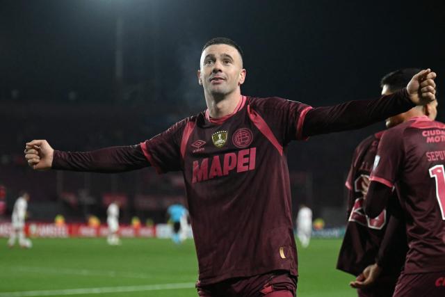 Lanus' midfielder #23 Ramiro Carrera celebrates after scoring his team's second goal during the first leg of the Copa Sudamericana knockout round play-off football match between Argentina's Lanus and Peru's Cienciano, at the Ciudad de Lanus stadium, in Lanus, Buenos Aires province, Argentina on July 22, 2026. (Photo by Luis ROBAYO / AFP)