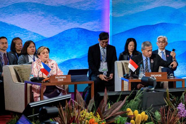 Philippines Foreign Secretary Theresa Lazaro (L) and Singapore Foreign Minister Vivian Balakrishnan attend the 33rd ASEAN Regional Forum (ARF), part of the Association of Southeast Asian Nations (ASEAN) Foreign Ministers Meeting in Pasay, Metro Manila on July 23, 2026. (Photo by Ezra Acayan / POOL / AFP)