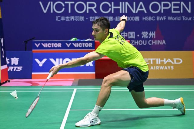 Christo Popov of France hits a return to Lin Chun-Yi of Taiwan during their men's singles round 16 match at the China Open badminton tournament in Changzhou, eastern China's Jiangsu province on July 23, 2026. (Photo by CN-STR / AFP) / China OUT