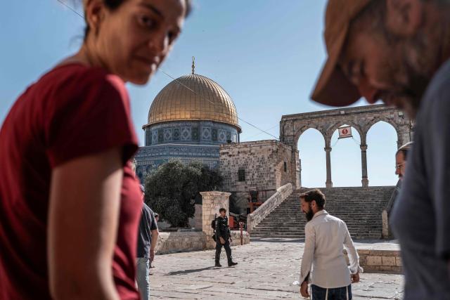 Israelis are seen at Al-Aqsa Mosque compound during the day of Tisha B'Av (the ninth day of Av) where they commemorate the destruction of the first and second temples in Jerusalem by the ancient Babylonians and Romans respectively, in Jerusalem on July 23, 2026. (Photo by ilia YEFIMOVICH / AFP)