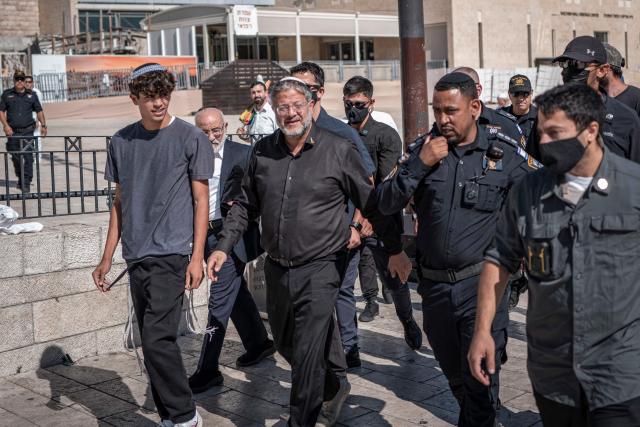 Israel's far-right National Security Minister Itamar Ben Gvir (C) enters Al-Aqsa Mosque compound during the day of Tisha B'Av (the ninth day of Av) commemorating the destruction of the first and second temples in Jerusalem by the ancient Babylonians and Romans respectively, in Jerusalem on July 23, 2026. (Photo by ilia YEFIMOVICH / AFP)