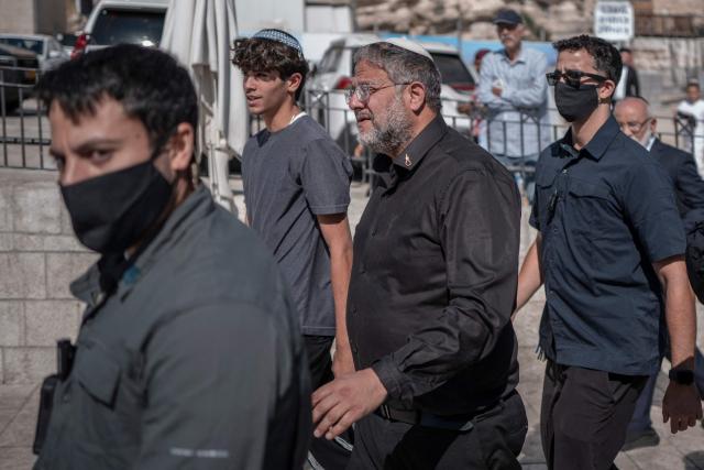 Israel's far-right National Security Minister Itamar Ben Gvir (C) enters Al-Aqsa Mosque compound during the day of Tisha B'Av (the ninth day of Av) commemorating the destruction of the first and second temples in Jerusalem by the ancient Babylonians and Romans respectively, in Jerusalem on July 23, 2026. (Photo by ilia YEFIMOVICH / AFP)