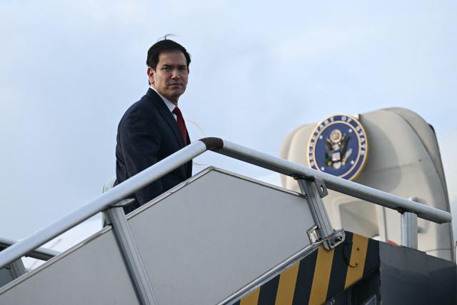 US Secretary of State Marco Rubio walks up the steps to his plane as he departs at Ninoy Aquino International Airport in Manila on July 23, 2026, following his visit to attend the Association of Southeast Asian Nations (ASEAN) Foreign Ministers Meeting. (Photo by Brendan SMIALOWSKI / POOL / AFP)