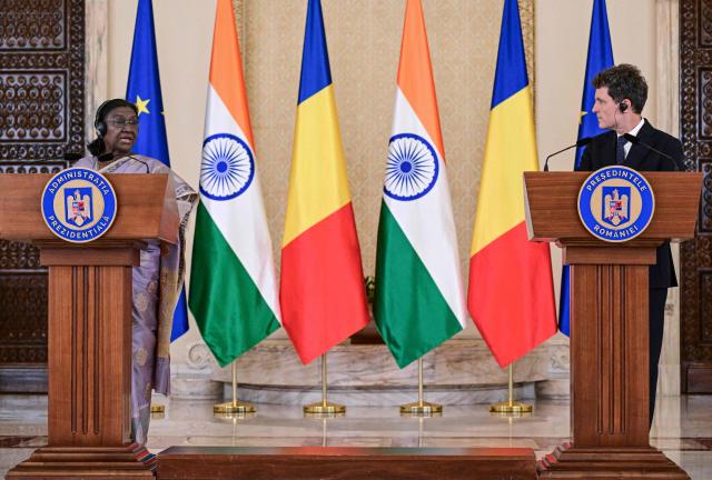 Indian President Droupadi Murmu (L) addresses a joint press conference with Romanian President Nicusor Dan at the presidential Cotroceni Palace in Bucharest on July 23, 2026. Indian President Droupadi Murmu is on a three-day state visit to Romania. (Photo by Daniel MIHAILESCU / AFP)