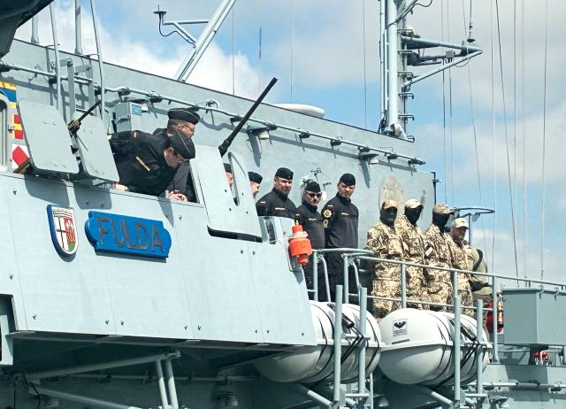 (FILES) Patr of the crew stand on board as the German navy's minehunter boat "Fulda" leaves the harbour of Kiel, northern Germany, on May 4, 2026, to set sail for the Mediterranean as part of a pre-deployment operation in preparation for a possible mission in the Strait of Hormuz. The German navy will move two vessels from the Red Sea region to the eastern Mediterannean "in the coming days", the defence ministry said in a statement on July 23, 2026. The "Fulda" minesweeper and the "Mosel" supply ship were currently in Djibouti, a ministry spokesman confirmed to AFP. They had been sent last month in preparation for a possible mission in the Strait of Hormuz after the end of the US-Iran war. However the ministry statement cited the "the volatile political situation... and the absence of any foreseeable near-term start of operations" in the Strait of Hormuz. (Photo by Sandra BECKEFELDT / AFP)